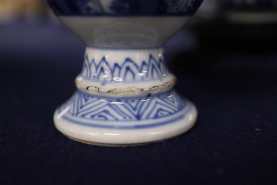 A Chinese blue and white tea bowl and saucer and two jars, Kangxi, some damage largest diameter 11cm